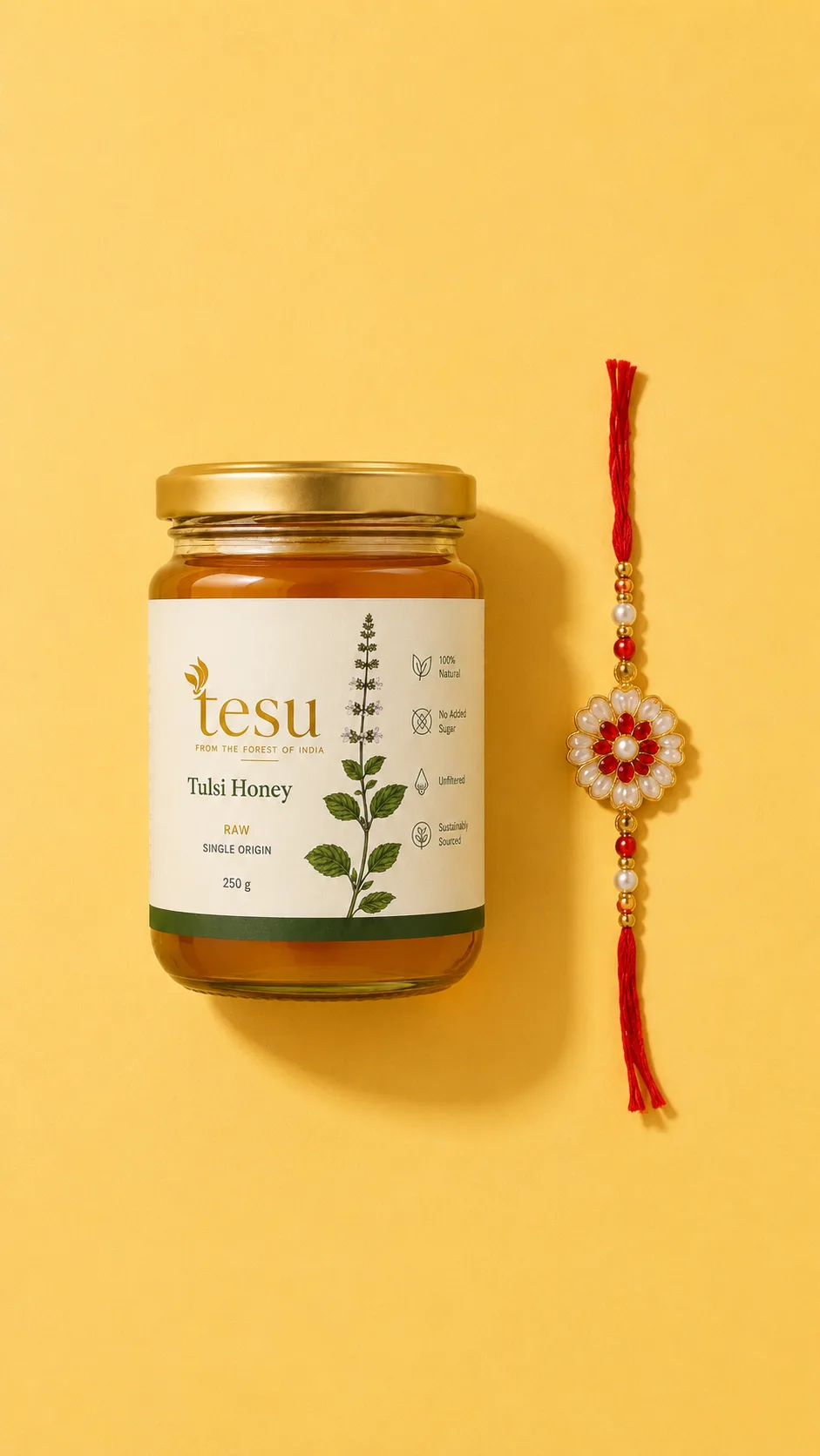 A jar of Tesu Tulsi honey beside a rakhi